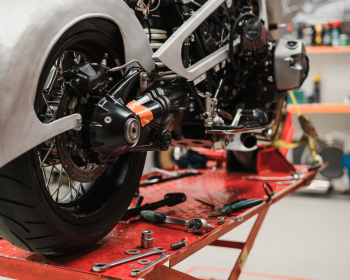 Custom motorcycle standing in repair shop